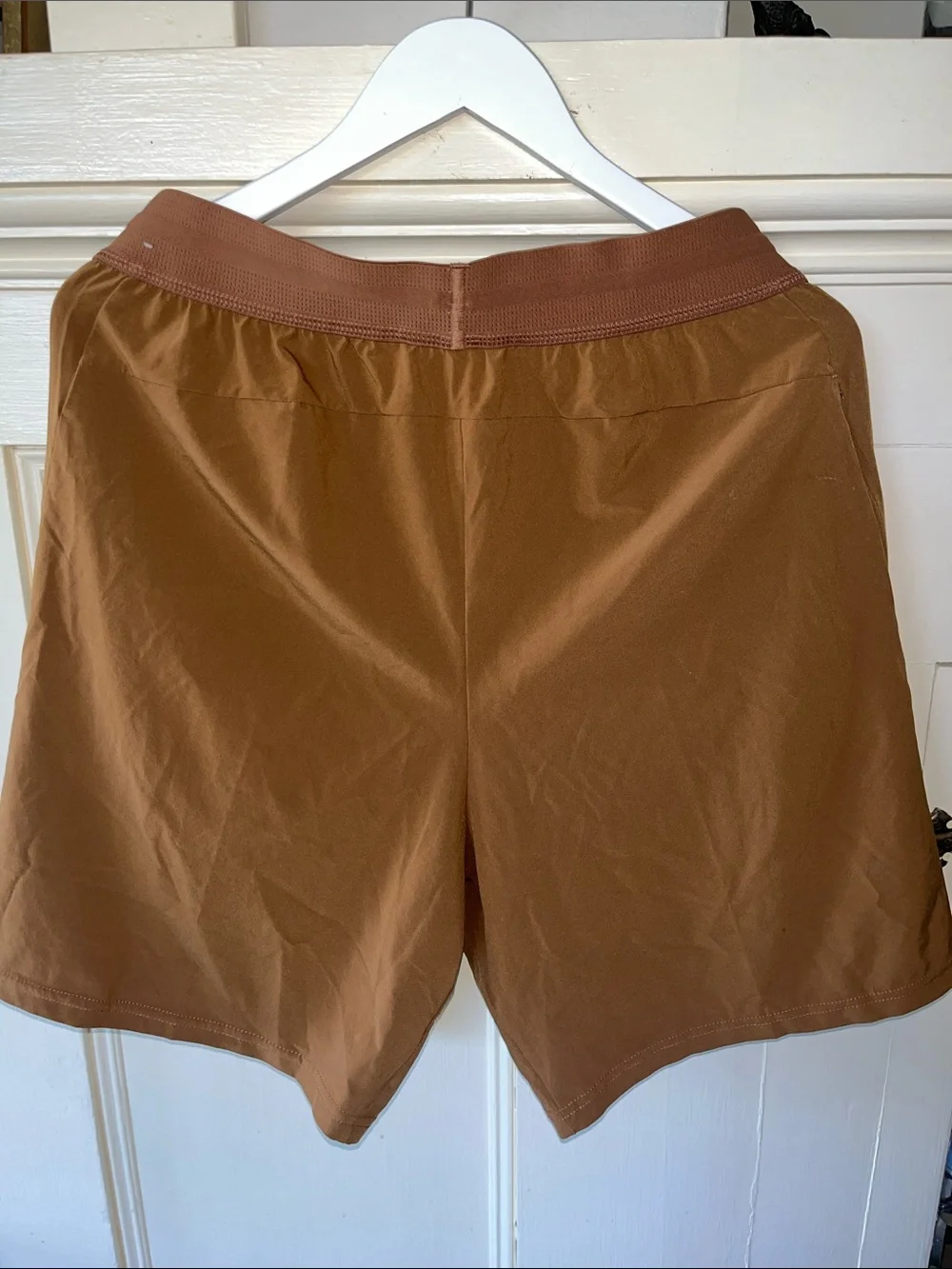 Nike Men's Tan Athletic Shorts.